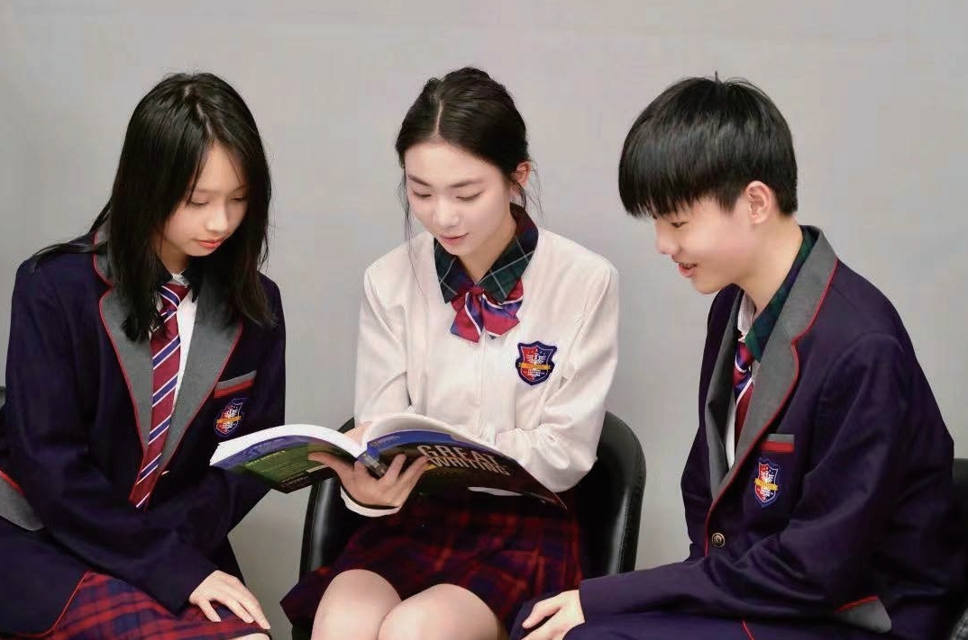 Students sharing a book, from the Ningbo campus profile