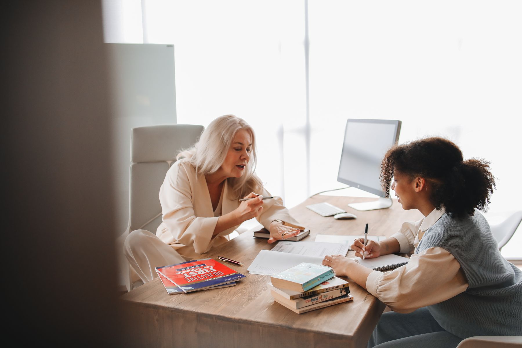 A student meeting one-to-one with an education adviser