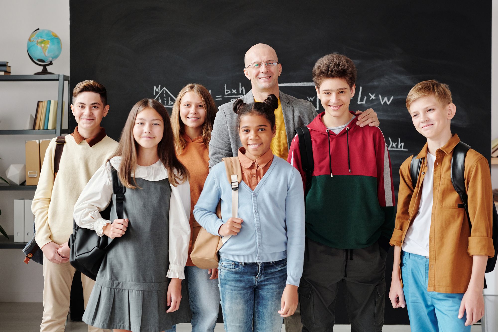 Students and a teacher together in a classroom — illustrative education photography