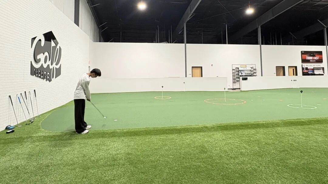 Students taking part in the indoor golf session