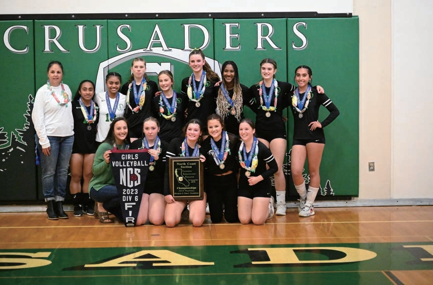 St. Bernard’s Academy girls volleyball team with championship medals