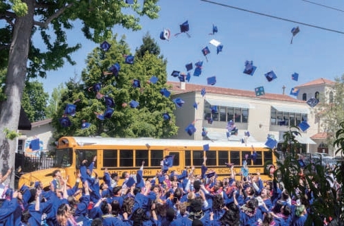 Saint Joseph Notre Dame graduates celebrating outdoors